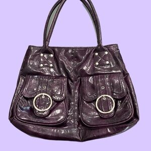 Stylish Purple Shoulder Bag with Leather Material and Decorative Elements
